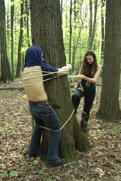 Free porn pics of Mistress switching her slave in the woods 6 of 34 pics