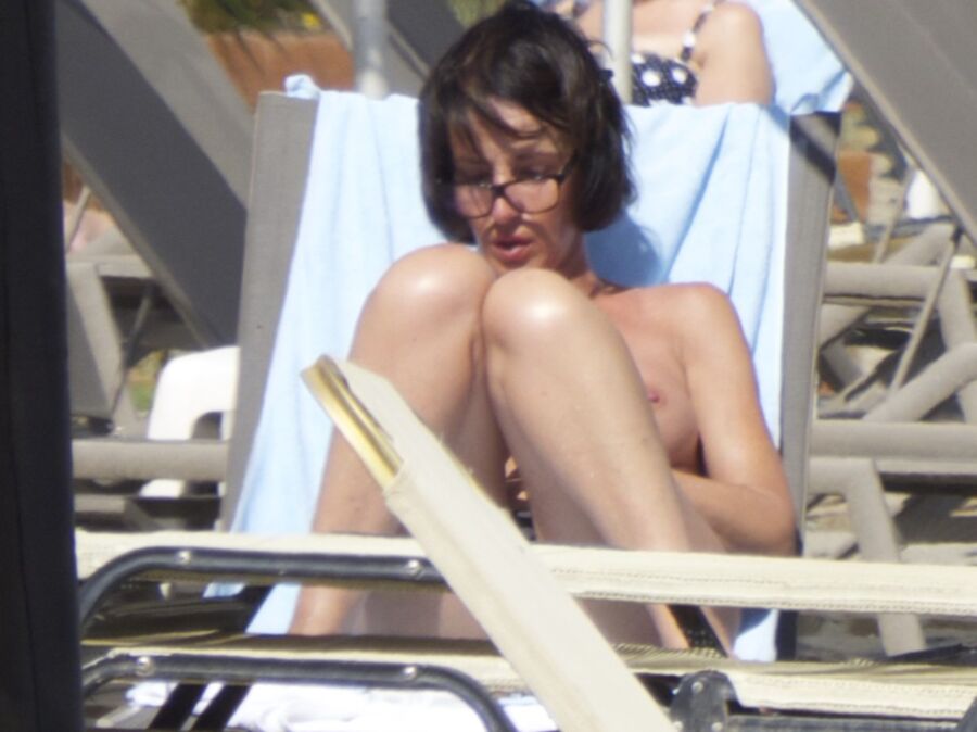 Free porn pics of Brunette caught topless in Agia Marina, Creta! 2 of 35 pics