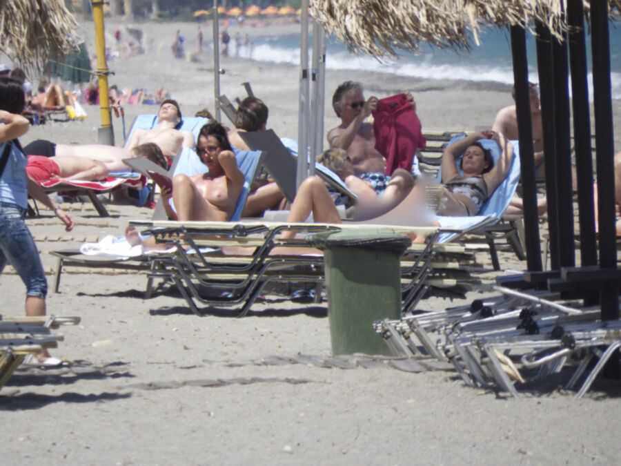 Free porn pics of Brunette caught topless in Agia Marina, Creta! 13 of 35 pics