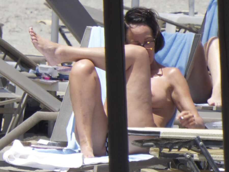 Free porn pics of Brunette caught topless in Agia Marina, Creta! 18 of 35 pics
