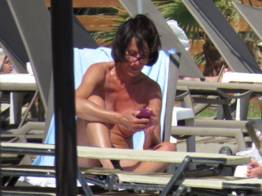 Free porn pics of Brunette caught topless in Agia Marina, Creta! 1 of 35 pics
