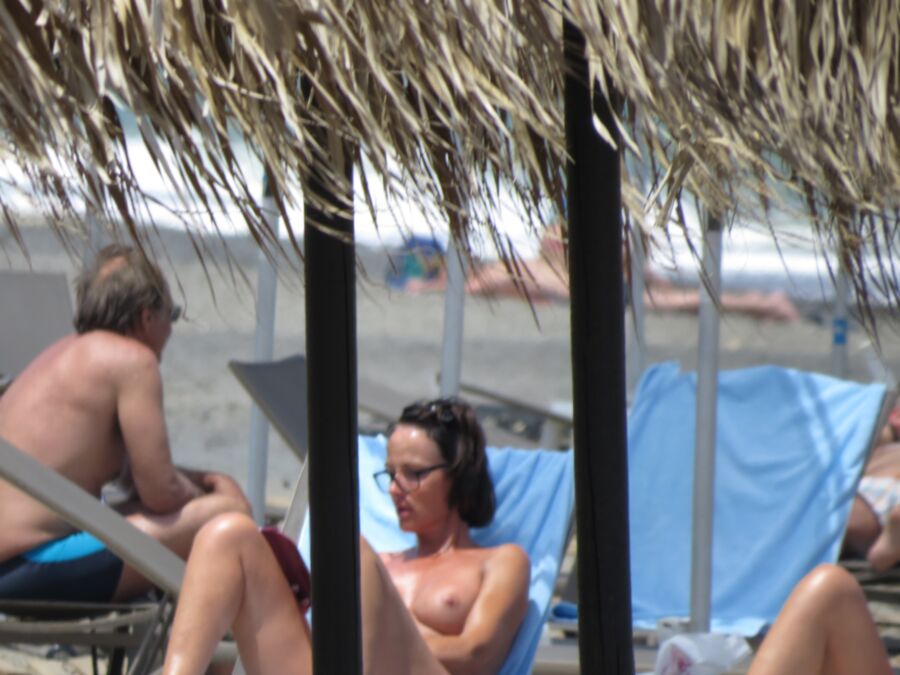 Free porn pics of Brunette caught topless in Agia Marina, Creta! 19 of 35 pics