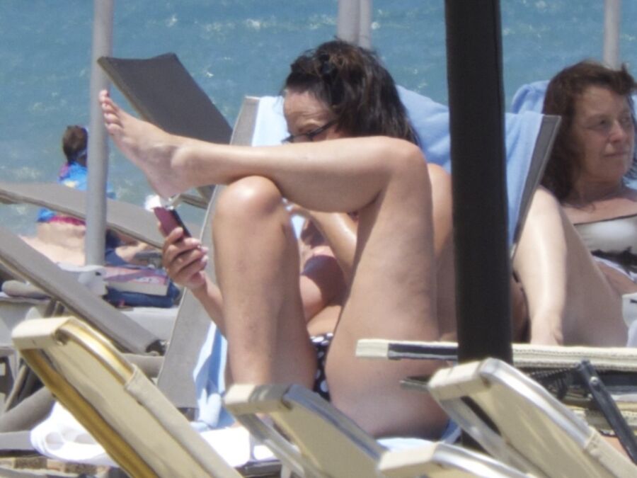 Free porn pics of Brunette caught topless in Agia Marina, Creta! 17 of 35 pics