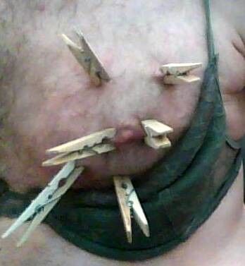 Free porn pics of Crossdresser breast in clothespins 3 of 4 pics