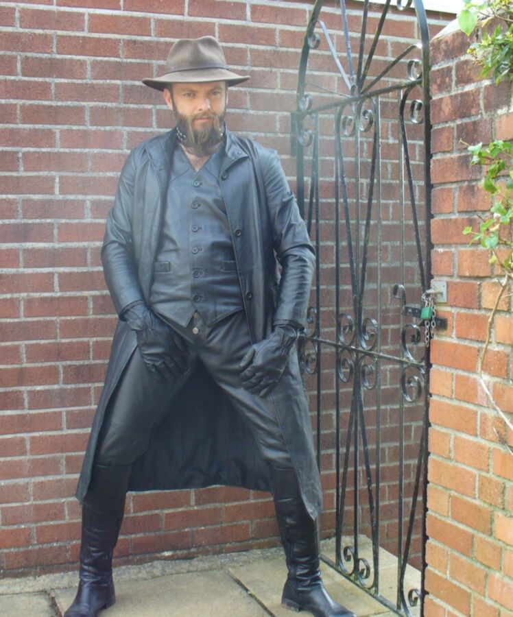 Free porn pics of Leather master in long coat and boots 1 of 15 pics