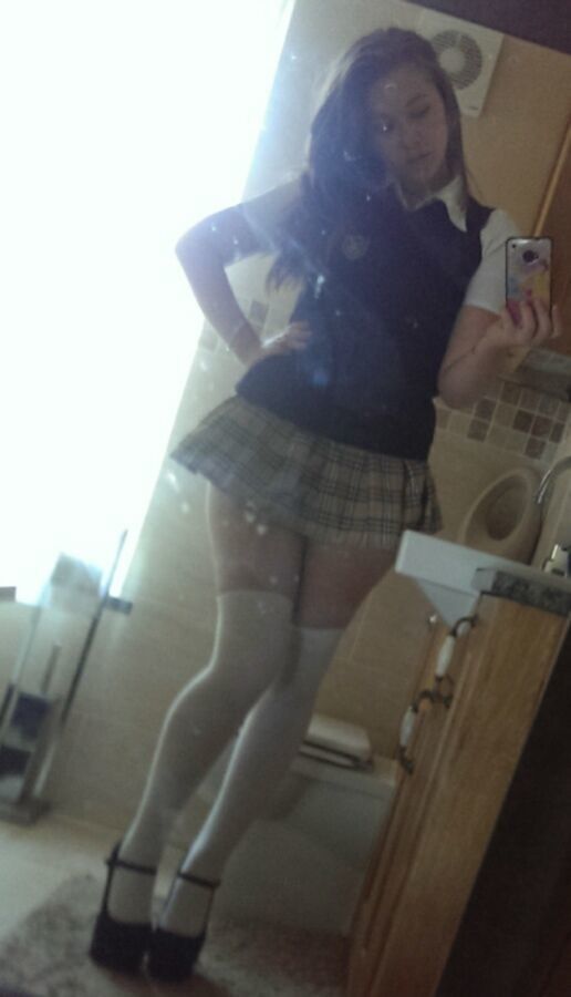 Free porn pics of Super Hot Teen in school girl outfit with stocking and heels 7 of 12 pics