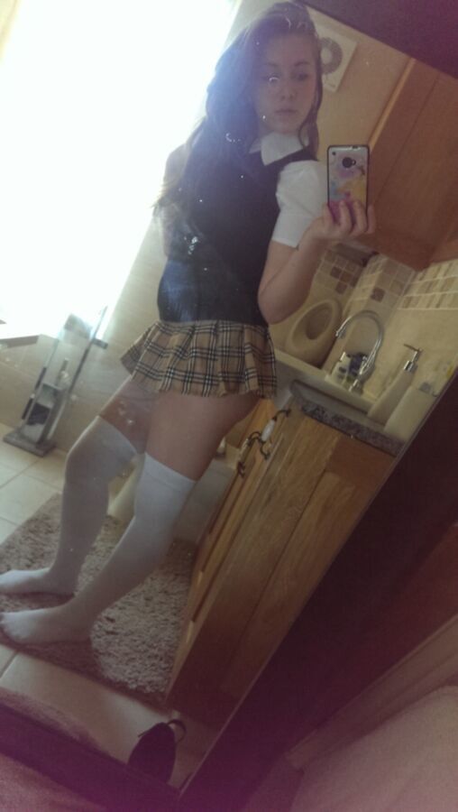 Free porn pics of Super Hot Teen in school girl outfit with stocking and heels 3 of 12 pics