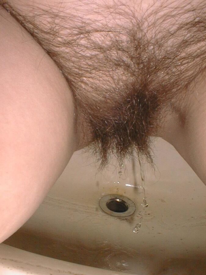 Free porn pics of Hairy amateur pees and takes it up the ass 14 of 25 pics