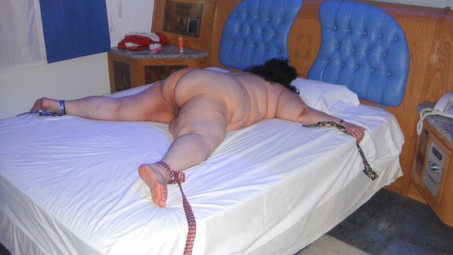 Free porn pics of My submissive bbw is tied spreadeagle face down and ass up 6 of 8 pics