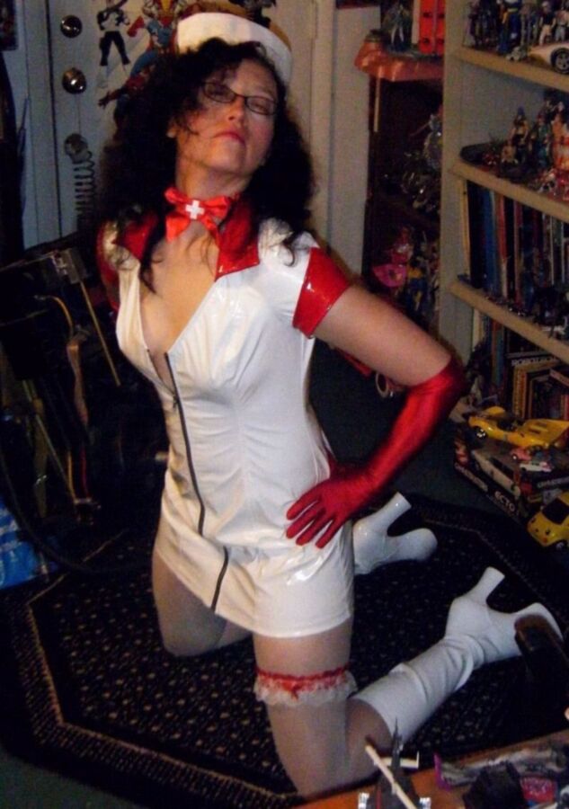 Free porn pics of PVC Nurse wants to service your Hard Cock 5 of 5 pics
