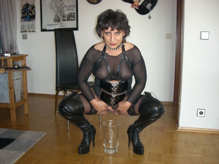 Mature Dominatrix In Leather