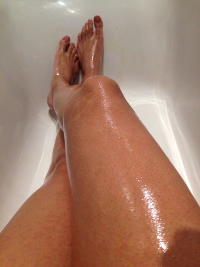 Free porn pics of Oiling my smooth legs. 24 of 33 pics