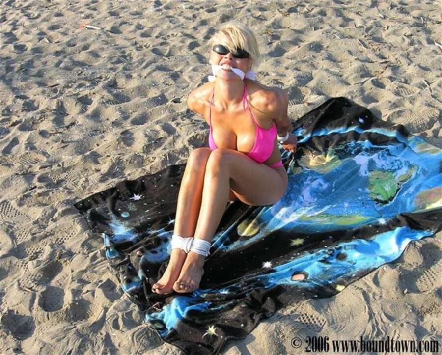 Free porn pics of Bikini blonde tied on the beach 2 of 35 pics