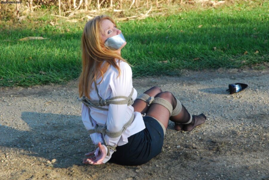 Free porn pics of Tied and gagged girl on the wood road 5 of 36 pics