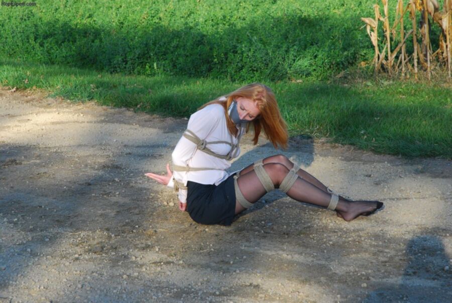 Free porn pics of Tied and gagged girl on the wood road 14 of 36 pics