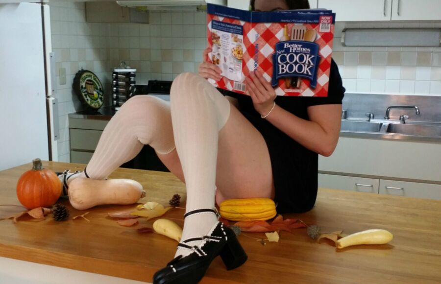 Free porn pics of Petite woman in white kneesocks cavorts in the kitchen 2 of 30 pics