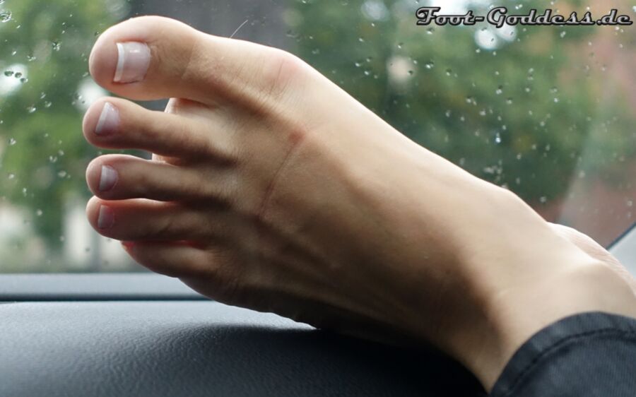 Free porn pics of Foot-Goddess Gosia Feet barefoot in car toes with french nails 4 of 15 pics
