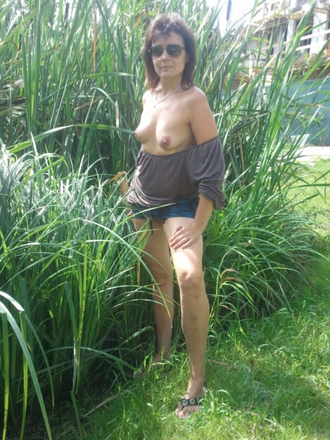 Free porn pics of tits out in the backyard 2 of 15 pics