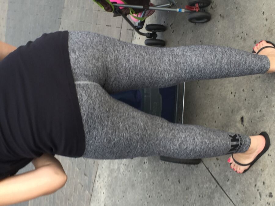 Free porn pics of sexy young mom wearing yoga pants in amusement park 9 of 9 pics