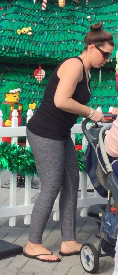 Free porn pics of sexy young mom wearing yoga pants in amusement park 5 of 9 pics