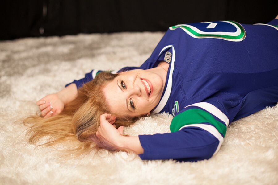 Free porn pics of Woman does boudoir shoot in hockey jersey & glasses 14 of 22 pics
