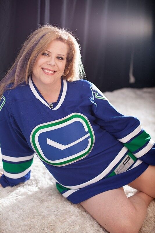 Free porn pics of Woman does boudoir shoot in hockey jersey & glasses 11 of 22 pics