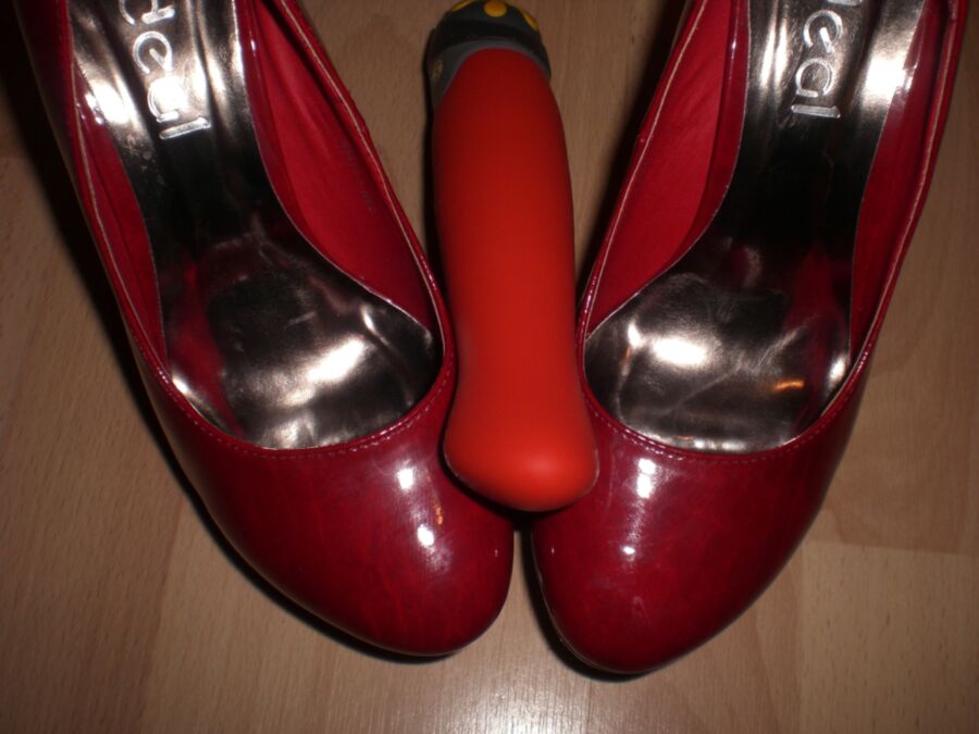 Free porn pics of Cum over her red Heels and her toys 4 of 19 pics