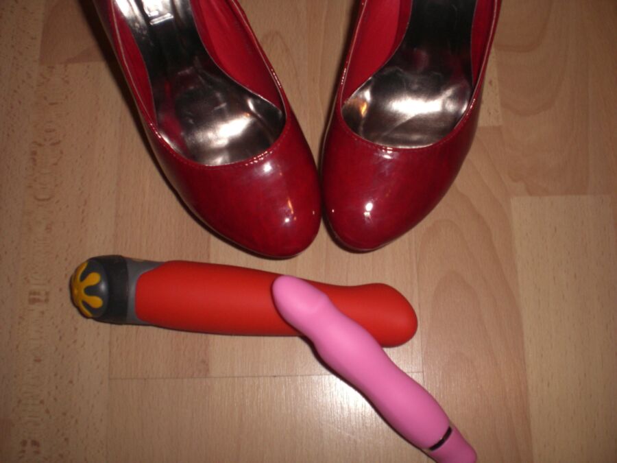 Free porn pics of Cum over her red Heels and her toys 10 of 19 pics