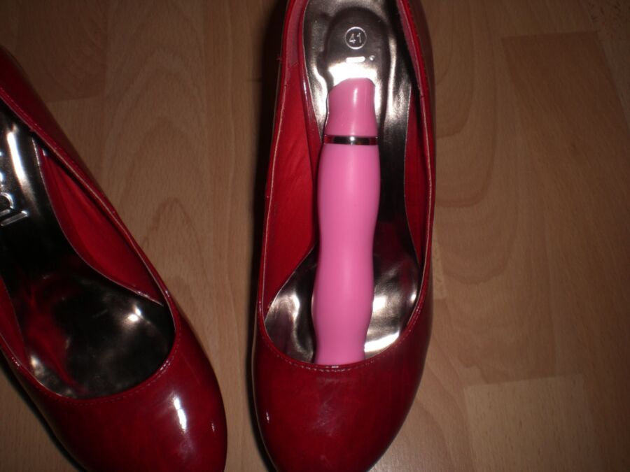 Free porn pics of Cum over her red Heels and her toys 8 of 19 pics