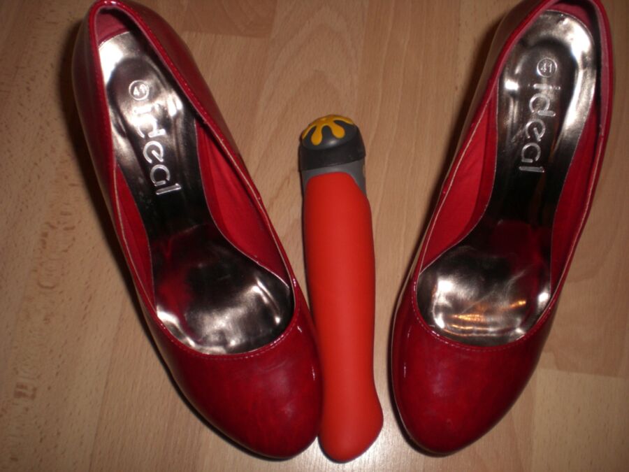 Free porn pics of Cum over her red Heels and her toys 3 of 19 pics