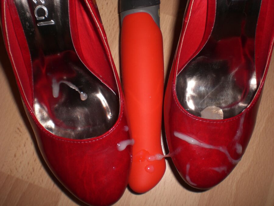 Free porn pics of Cum over her red Heels and her toys 12 of 19 pics