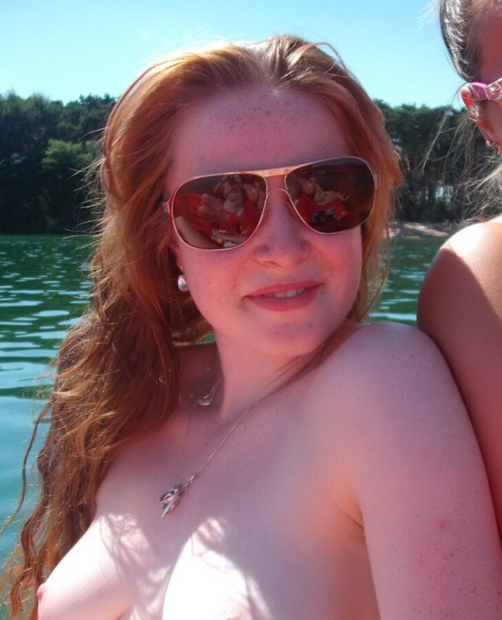 Free porn pics of Focus on the hot redhead at the lake 6 of 9 pics