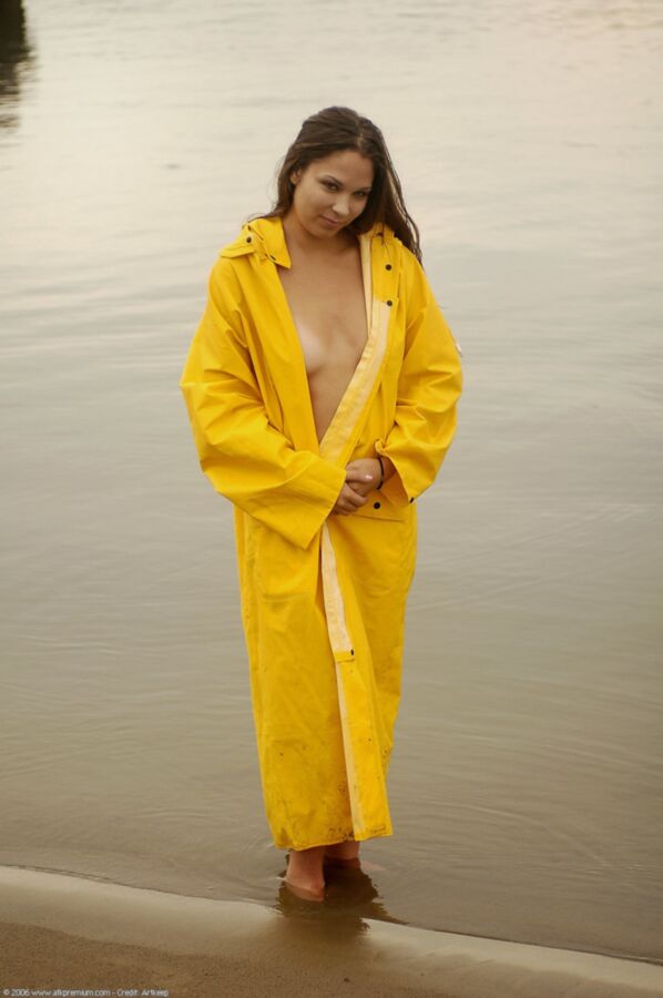 Free porn pics of Beautiful teen in yellow raincoat 1 of 7 pics