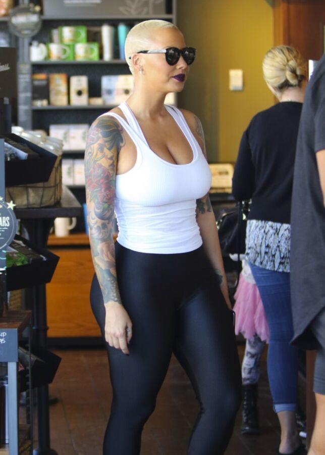 Free porn pics of Amber Rose Slutty ASS in black tights 1 of 16 pics