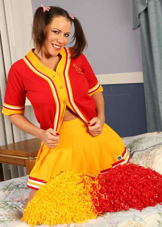 Free porn pics of Alicia Dimarco red and gold cheerleader 2 of 101 pics