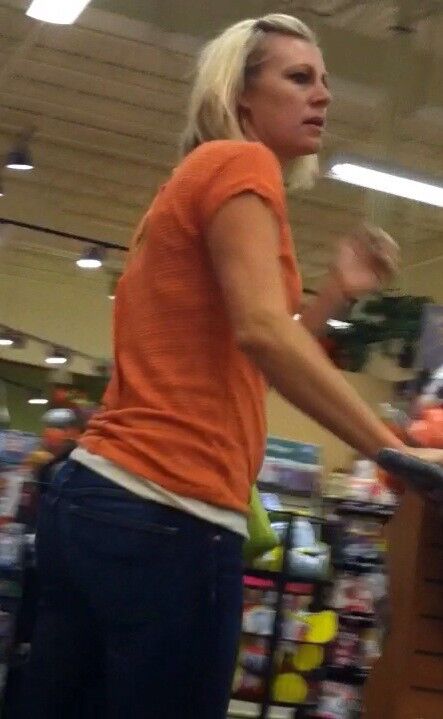 Free porn pics of Blonde MILF in orange top and jeans candid 2 of 16 pics