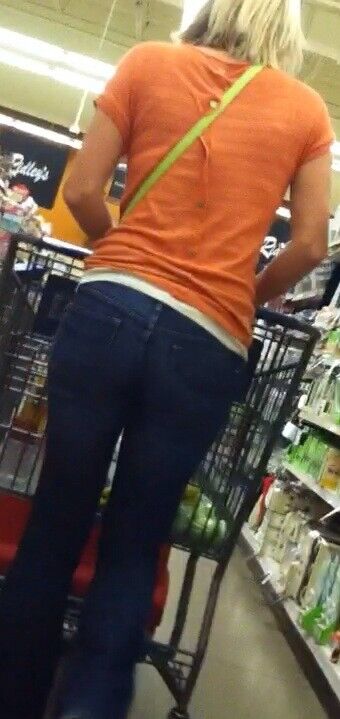 Free porn pics of Blonde MILF in orange top and jeans candid 5 of 16 pics
