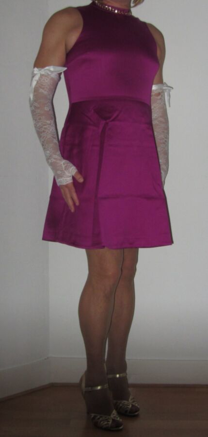 Free porn pics of Me Cindy Cross crossdressing in a cerise purple dress 2 of 3 pics