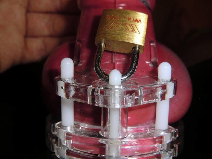 Free porn pics of Red Condom under Chastity with latex panty 8 of 13 pics