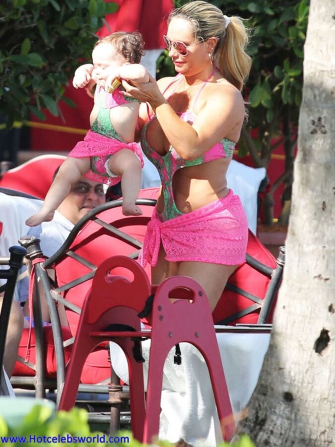 Free porn pics of Nicole Coco Austin in Pink Swimsuit in Miami 7 of 10 pics