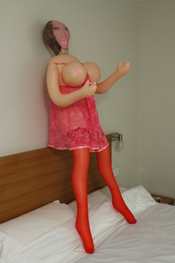 Free porn pics of Motel big tit love doll stands on the bed. 14 of 46 pics