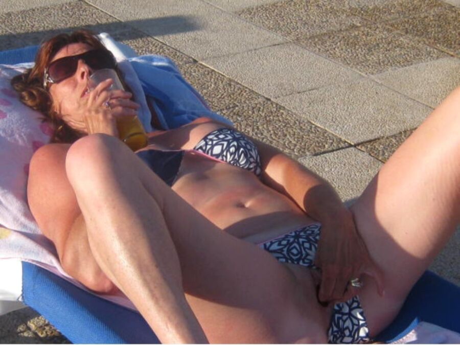 Free porn pics of candid milf on vacation 8 of 14 pics
