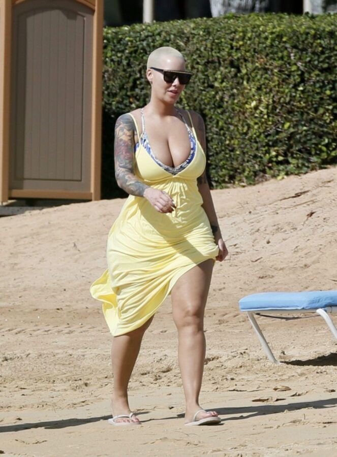 Free porn pics of Amber Rose thick ass again at the beach 1 of 10 pics