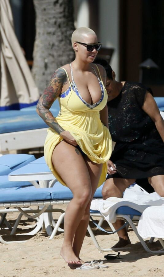 Free porn pics of Amber Rose thick ass again at the beach 2 of 10 pics