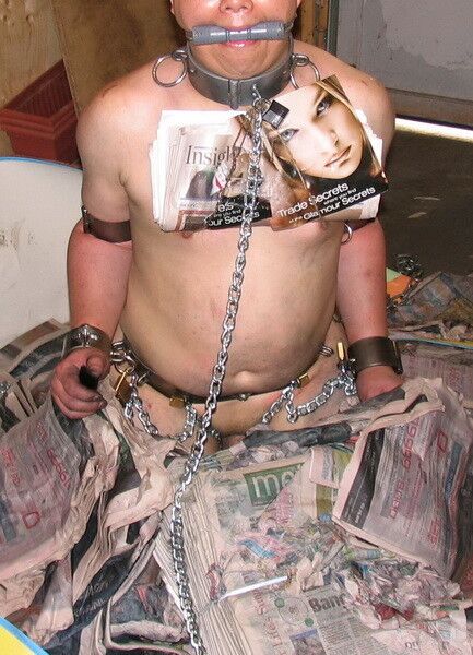 Free porn pics of Chained Up in a Pool of Wet Newspaper 4 of 13 pics
