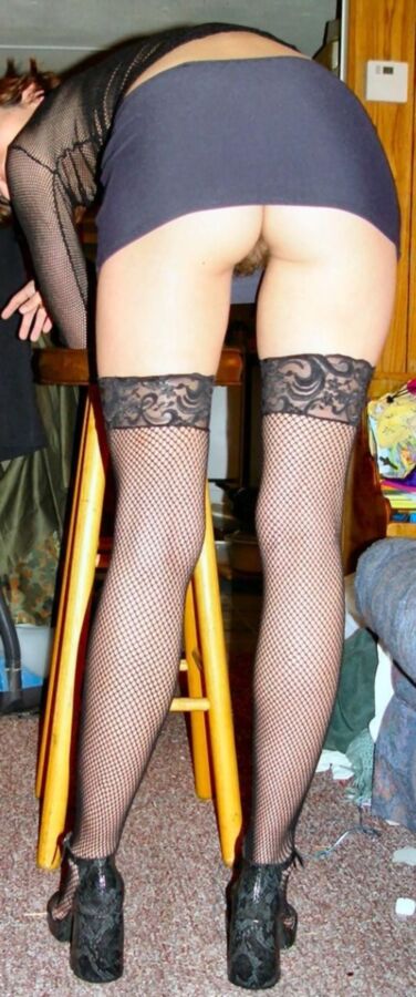 Free porn pics of Upskirt MILF long legs stockings 3 of 4 pics