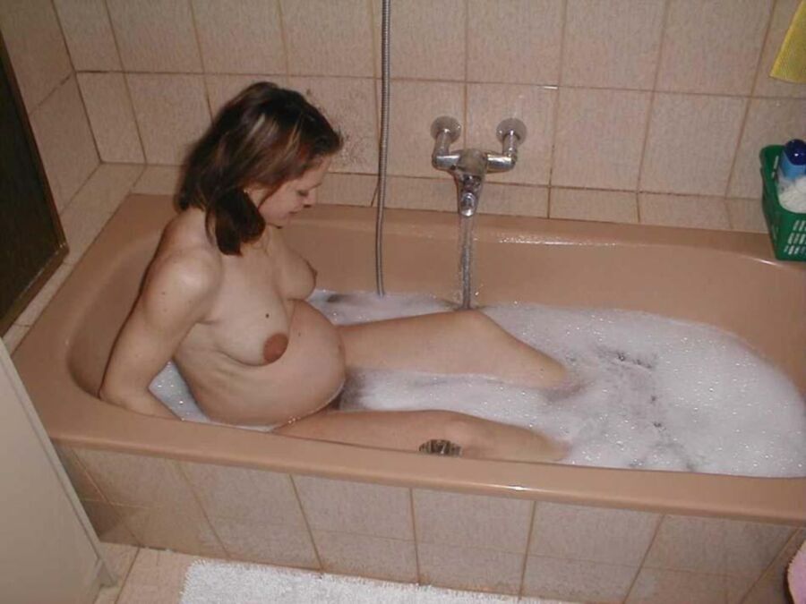 Free porn pics of Prego young MOM teases with full belly and superb swollen PUSSY 4 of 5 pics