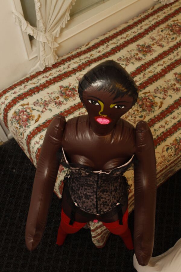 Free porn pics of Black doll wears corset and red pantyhose 17 of 59 pics