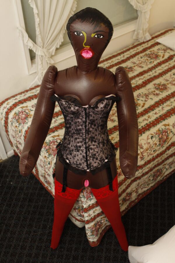 Free porn pics of Black doll wears corset and red pantyhose 21 of 59 pics