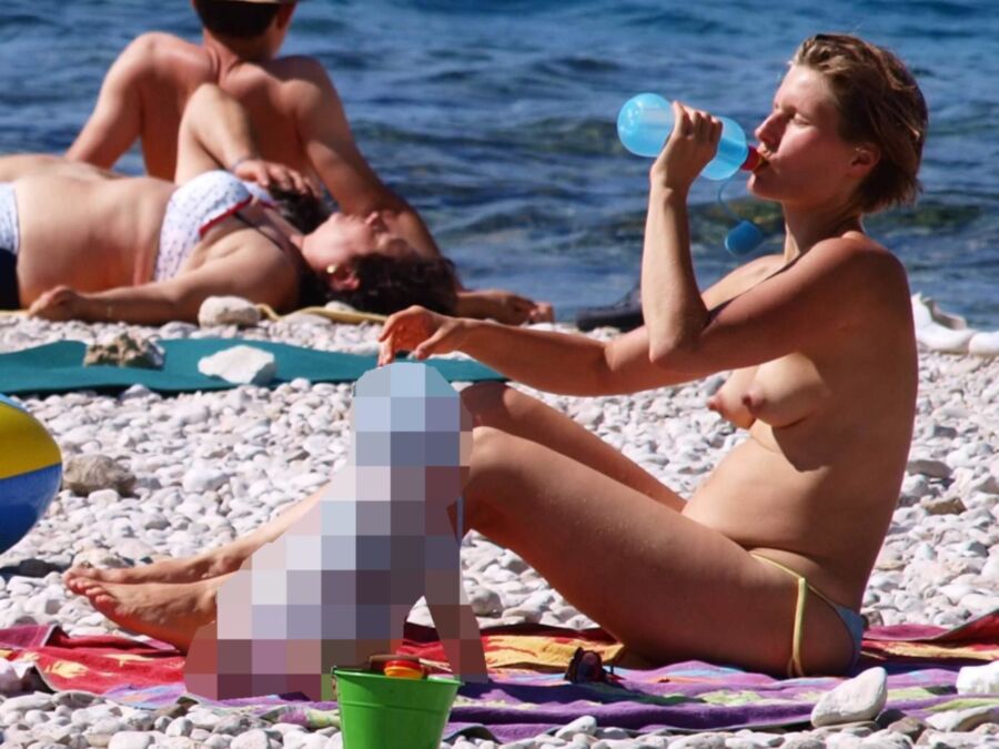 Free porn pics of Milf Topless On Beach 2 of 6 pics